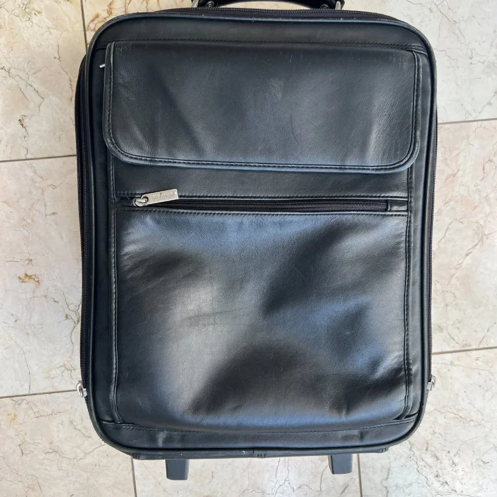 Wilson’s Black Leather Carry on Luggage.